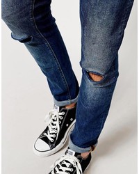 blaue enge Jeans mit Destroyed-Effekten von Asos