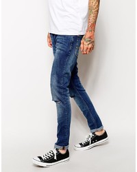 blaue enge Jeans mit Destroyed-Effekten von Asos