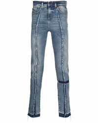 blaue enge Jeans mit Destroyed-Effekten von VAL KRISTOPHE