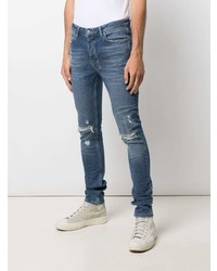 blaue enge Jeans mit Destroyed-Effekten von Ksubi