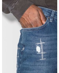 blaue enge Jeans mit Destroyed-Effekten von Ksubi