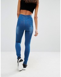 blaue enge Jeans mit Destroyed-Effekten von Missguided