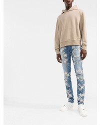 blaue enge Jeans mit Sternenmuster von Amiri