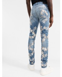 blaue enge Jeans mit Sternenmuster von Amiri