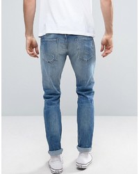 blaue Jeans mit Destroyed-Effekten von Replay