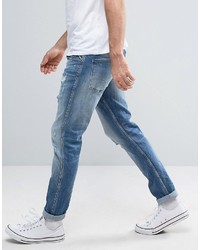 blaue Jeans mit Destroyed-Effekten von Replay