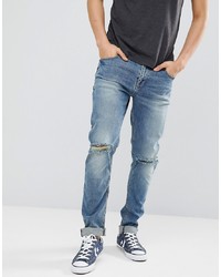 blaue Jeans mit Destroyed-Effekten von ASOS DESIGN