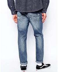 blaue Jeans mit Destroyed-Effekten von Asos