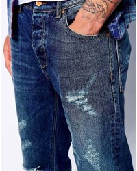 blaue Jeans mit Destroyed-Effekten von Asos