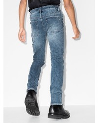 blaue Jeans mit Destroyed-Effekten von Ksubi