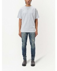 blaue Jeans mit Destroyed-Effekten von John Elliott