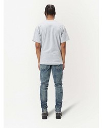 blaue Jeans mit Destroyed-Effekten von John Elliott