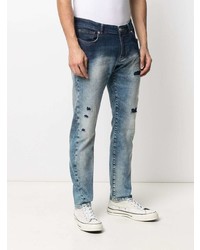 blaue Jeans mit Destroyed-Effekten von John Richmond