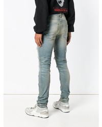 blaue Jeans mit Destroyed-Effekten von Amiri