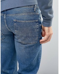 blaue Jeans mit Destroyed-Effekten von Asos