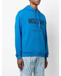 blauer bedruckter Pullover mit einem Kapuze von Moschino