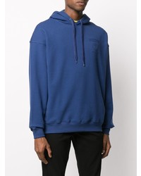 blauer Pullover mit einem Kapuze von Moschino