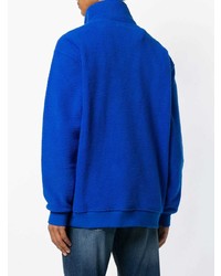 blauer Pullover mit einem Reißverschluss am Kragen von Tommy Jeans