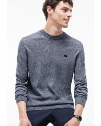 blauer Pullover mit einem Rundhalsausschnitt von Lacoste