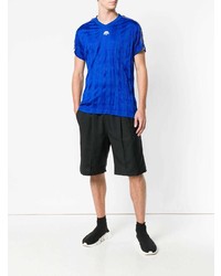 blaues bedrucktes T-Shirt mit einem V-Ausschnitt von Adidas Originals By Alexander Wang