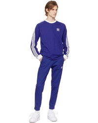 blaues horizontal gestreiftes Langarmshirt von adidas Originals