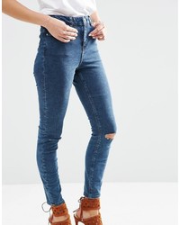 dunkelblaue enge Jeans aus Baumwolle mit Destroyed-Effekten von Asos