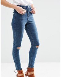 dunkelblaue enge Jeans aus Baumwolle mit Destroyed-Effekten von Asos