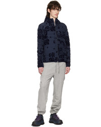 dunkelblaue Daunenjacke mit Blumenmuster von Moncler