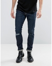 dunkelblaue enge Jeans mit Destroyed-Effekten von AllSaints