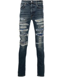 dunkelblaue enge Jeans mit Destroyed-Effekten von Amiri