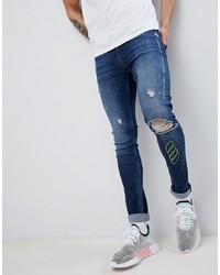 dunkelblaue enge Jeans mit Destroyed-Effekten von ASOS DESIGN