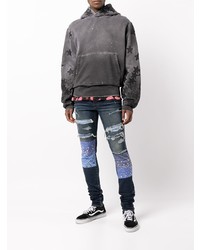 dunkelblaue enge Jeans mit Destroyed-Effekten von Amiri