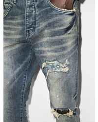 dunkelblaue enge Jeans mit Destroyed-Effekten von purple brand