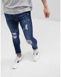 dunkelblaue enge Jeans mit Destroyed-Effekten von Brooklyn Supply Co.