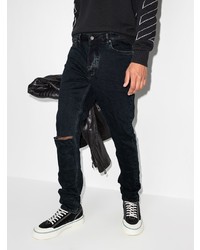 dunkelblaue enge Jeans mit Destroyed-Effekten von Ksubi