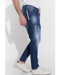 dunkelblaue enge Jeans mit Destroyed-Effekten von COURSE