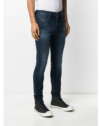 dunkelblaue enge Jeans mit Destroyed-Effekten von Diesel