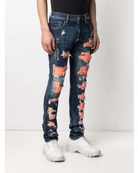 dunkelblaue enge Jeans mit Destroyed-Effekten von Philipp Plein