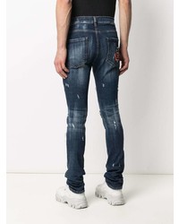 dunkelblaue enge Jeans mit Destroyed-Effekten von Philipp Plein