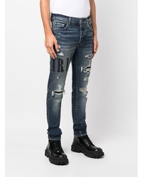 dunkelblaue enge Jeans mit Destroyed-Effekten von Amiri