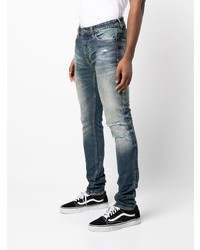 dunkelblaue enge Jeans mit Destroyed-Effekten von Ksubi