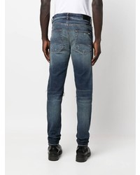 dunkelblaue enge Jeans mit Destroyed-Effekten von Amiri