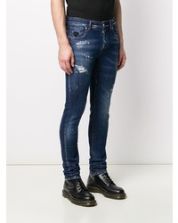 dunkelblaue enge Jeans mit Destroyed-Effekten von John Richmond