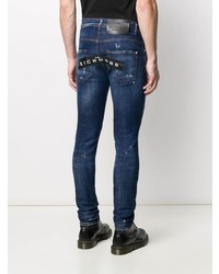 dunkelblaue enge Jeans mit Destroyed-Effekten von John Richmond