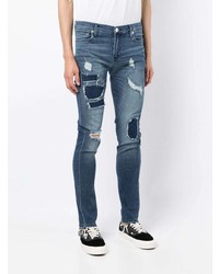 dunkelblaue enge Jeans mit Destroyed-Effekten von True Religion