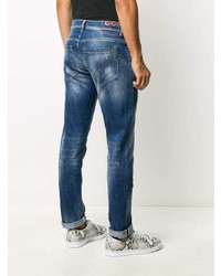 dunkelblaue enge Jeans mit Destroyed-Effekten von Dondup