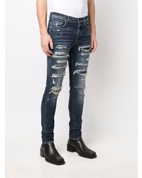 dunkelblaue enge Jeans mit Destroyed-Effekten von Amiri