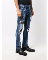 dunkelblaue enge Jeans mit Destroyed-Effekten von Philipp Plein