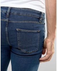 dunkelblaue enge Jeans mit Destroyed-Effekten von Asos