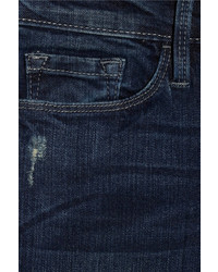 dunkelblaue enge Jeans mit Destroyed-Effekten